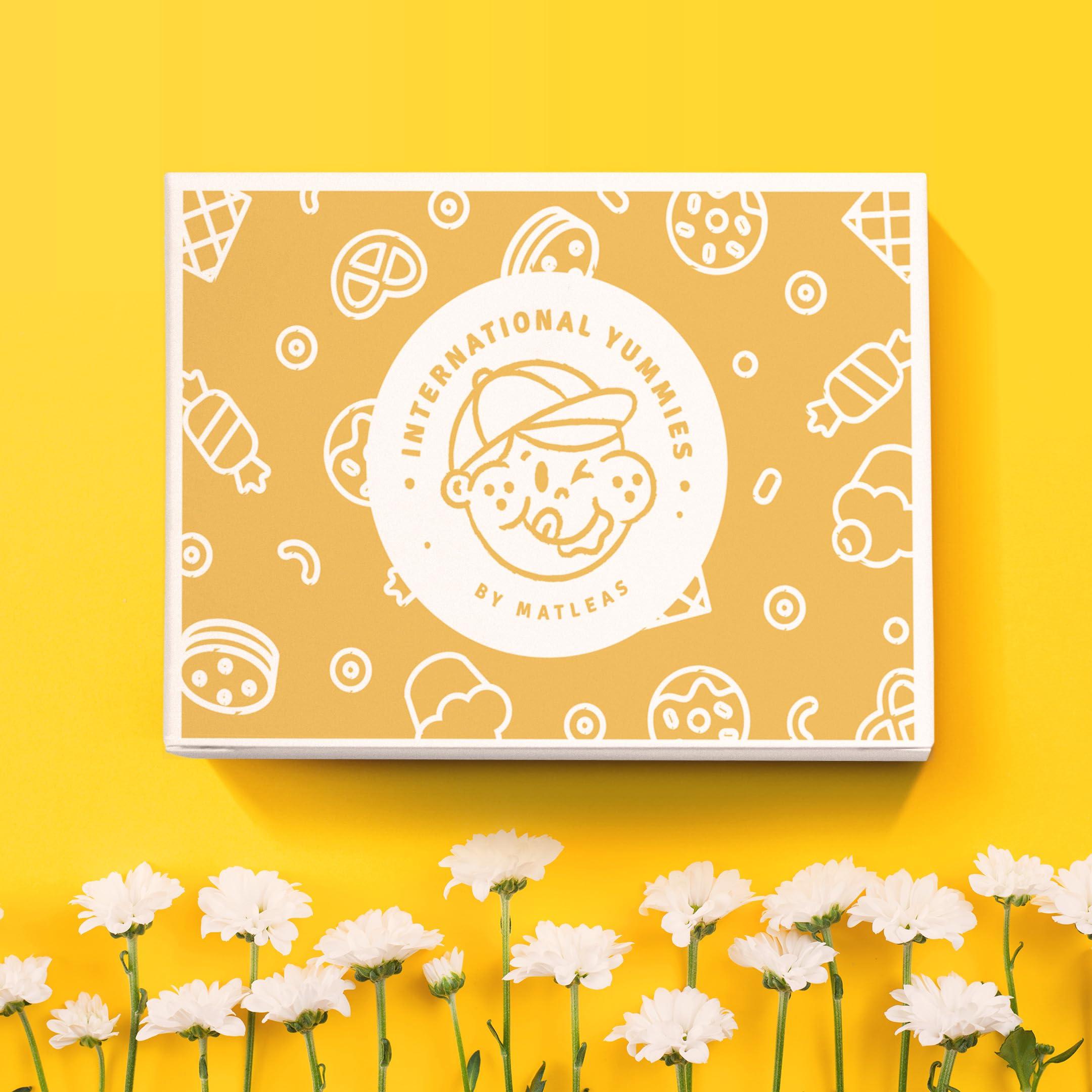 International Yummies by Matleas Maxi International Snack Box | Premium Exotic Foreign Snacks | Unique Snack Food Gifts Included | Saffran Yellow Theme | Candies from Around the World | 20 Full-Size + 1 Bonus Snacks